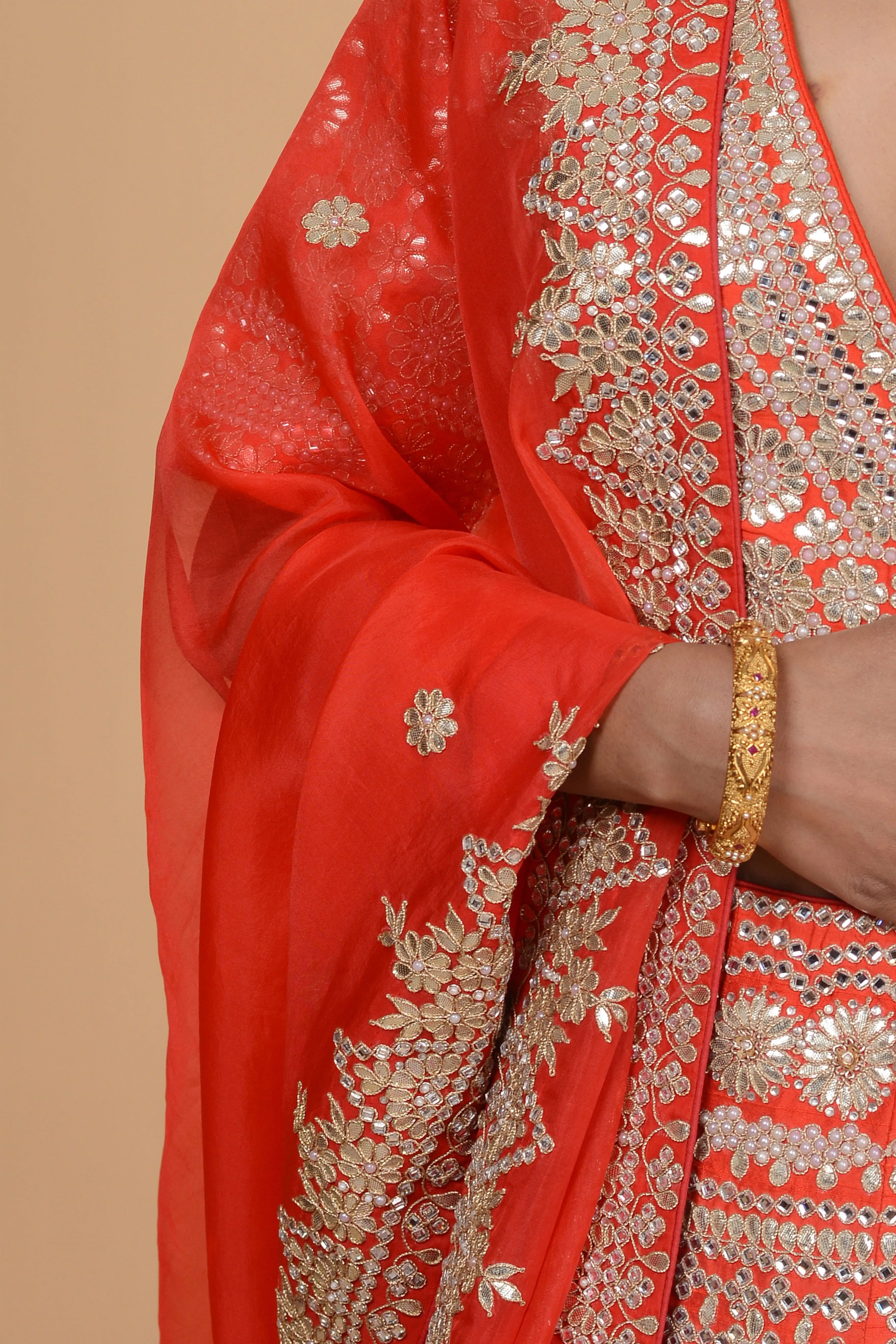 Bright Orange Embroidered Lehenga Set.